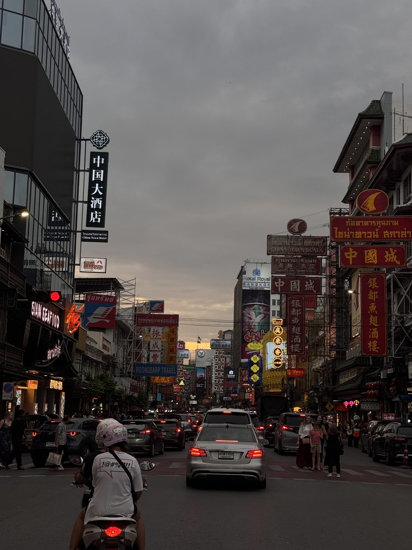 Evening traffic and signs in Bangkok's Chinatown